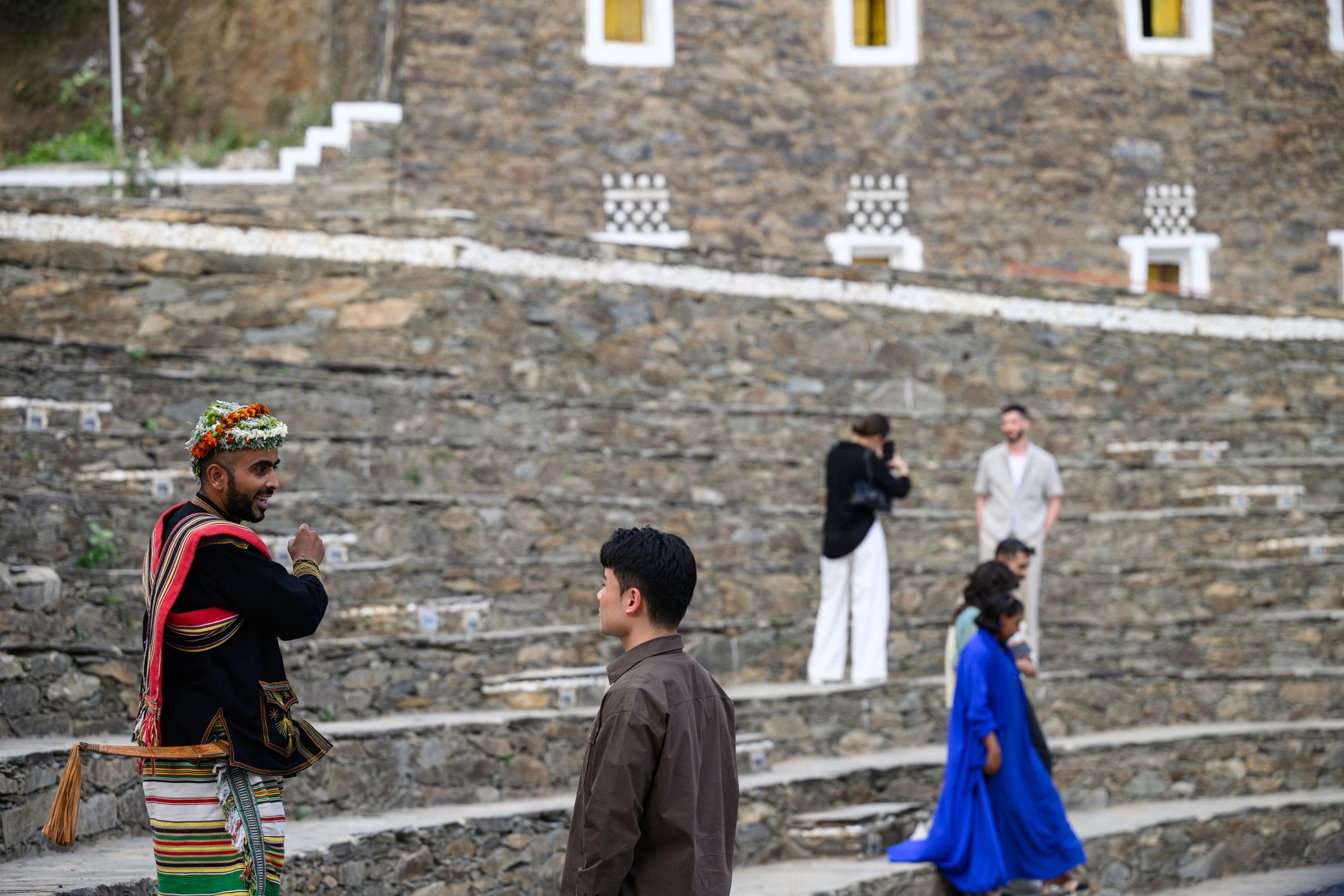 Guide and visitor in a historic village setting
